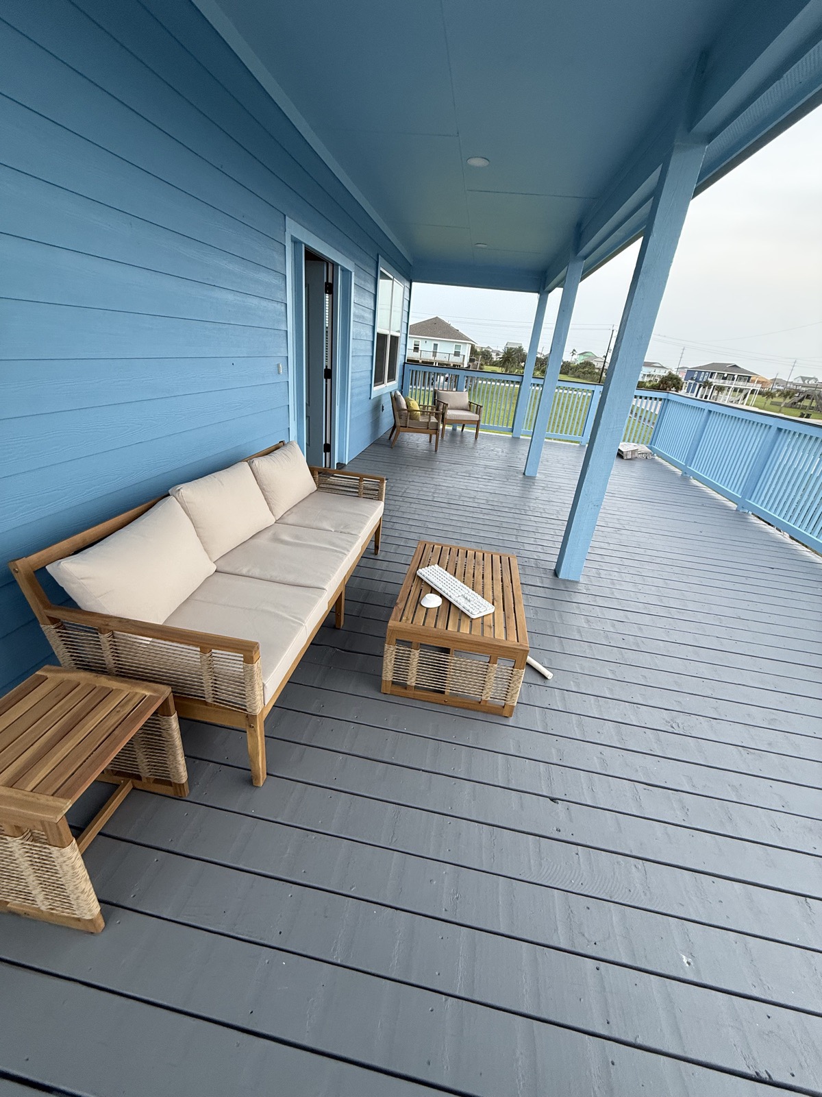 Outdoor furniture set assembled on a covered patio